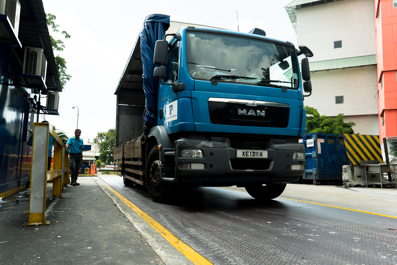 Rice-Media-Trash-Treasure-Life-Paper-11 Trucks being weighed on a digital scale that is accurate to the nearest 1kg